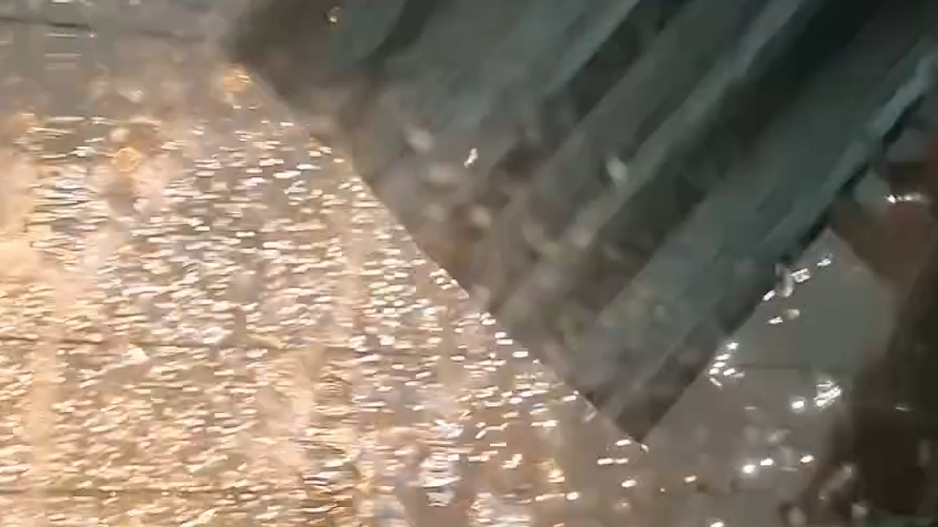 Storm winds rip metal roof from building in Brazil