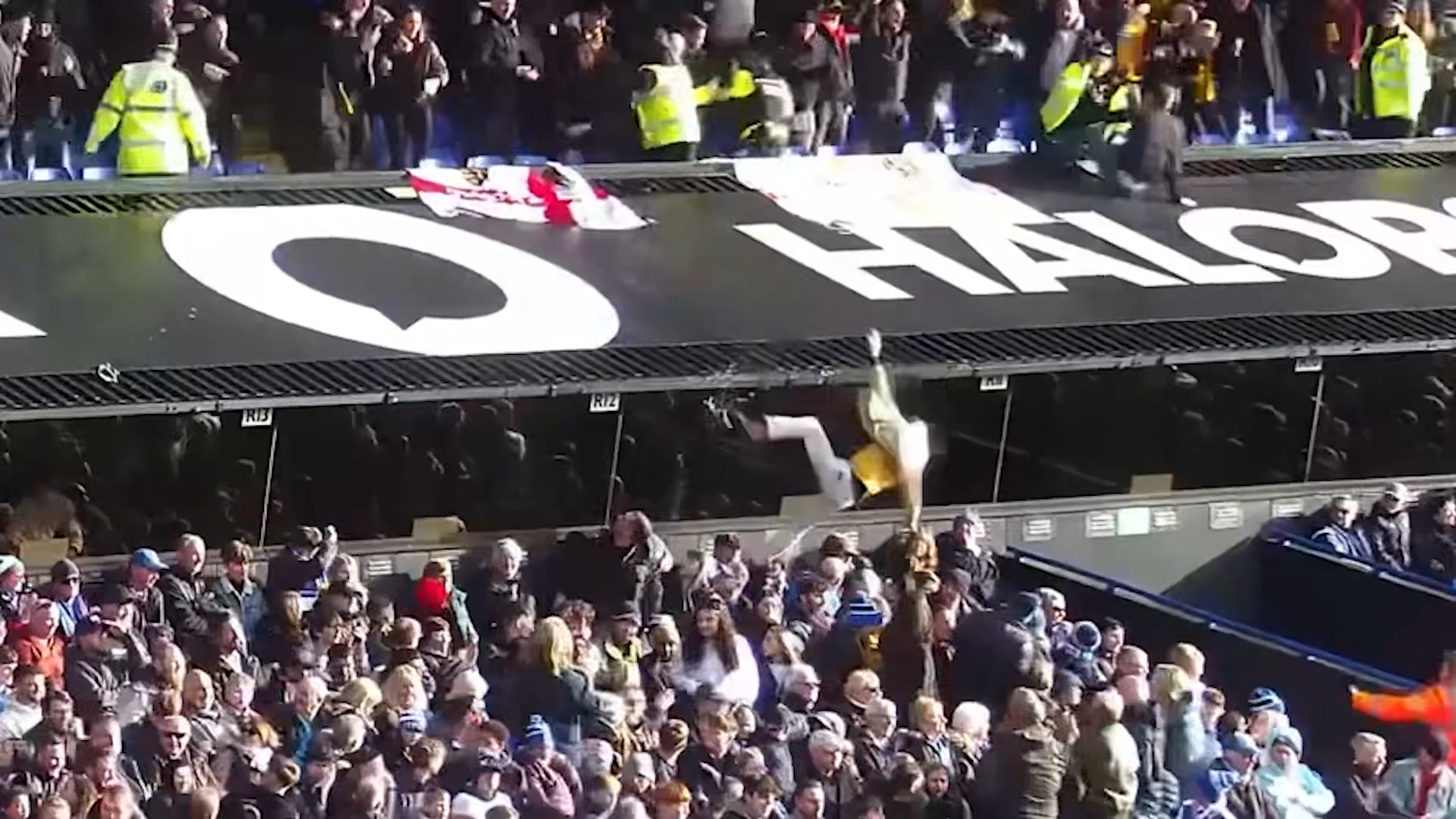Bizarre moment drunk footie fan falls from grandstand injuring woman in ...