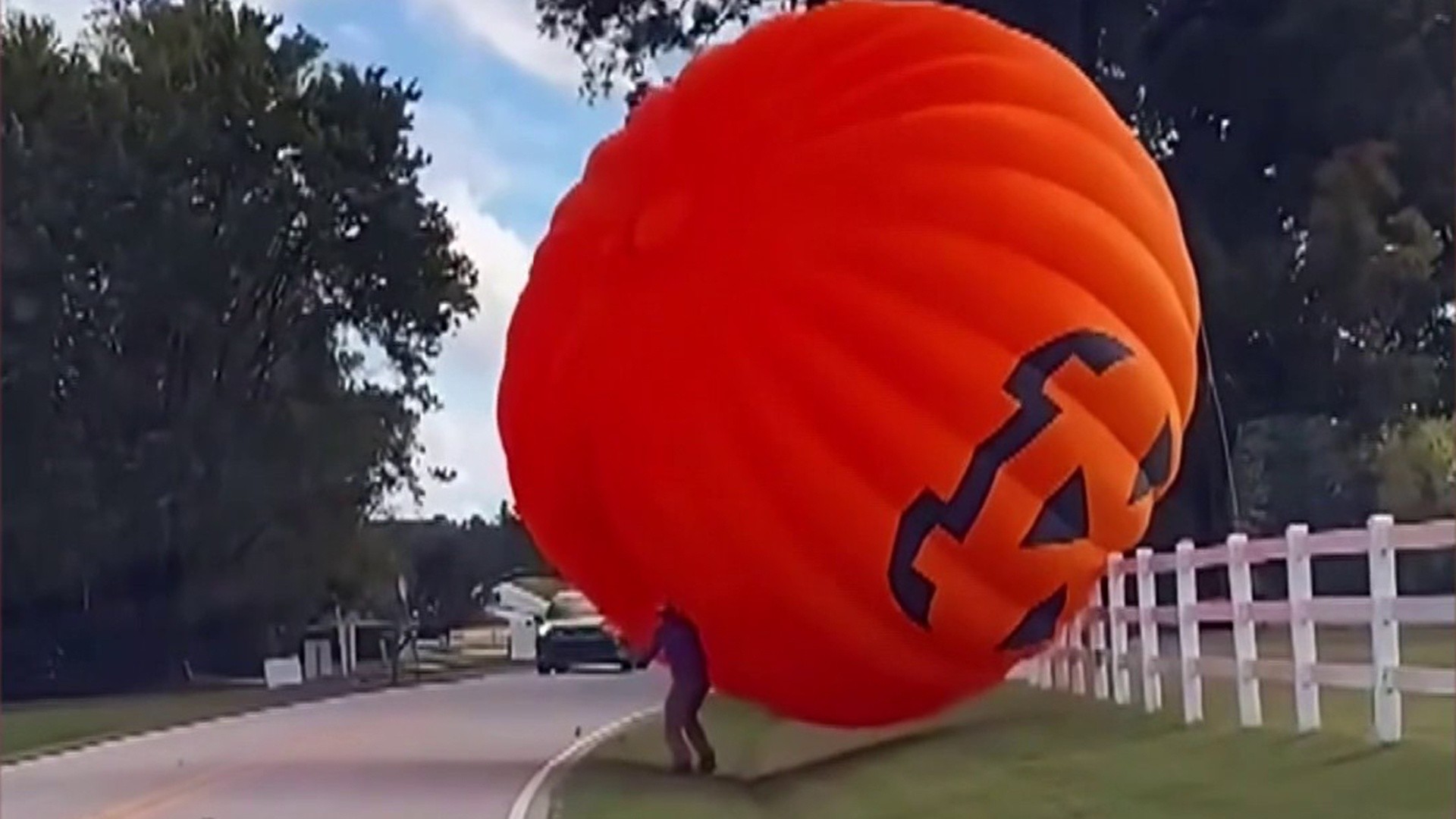 Watch: Giant inflatable pumpkin rolls down North Carolina road