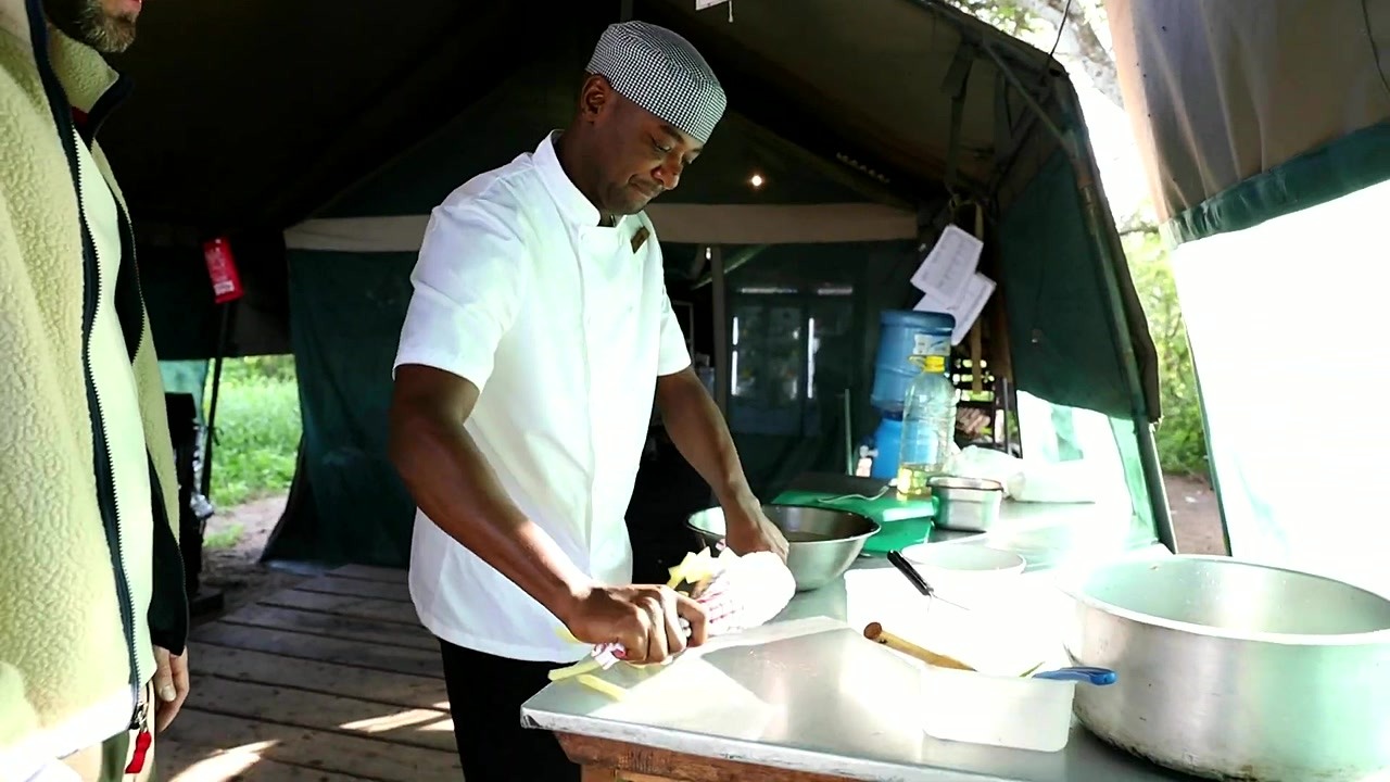 Cooking chips mayai in a Serengeti safari bush kitchen