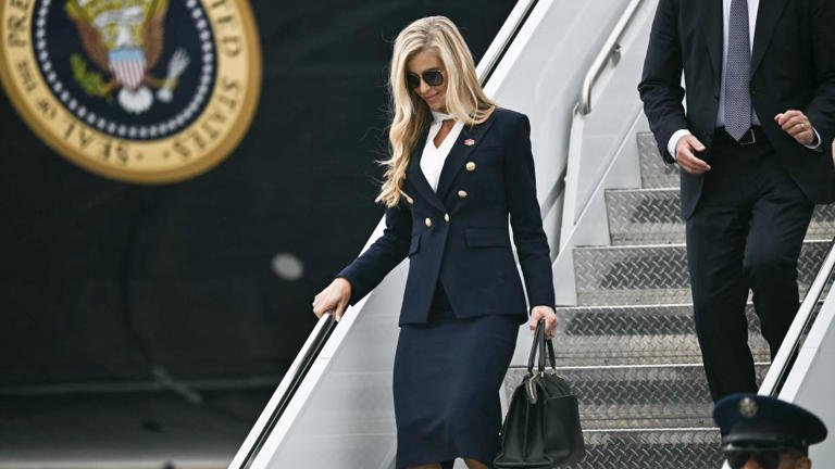 White House press secretary Katie Zacharia disembarks Air Force One at Elmendorf Air Force Base in Anchorage, Alaska, on October 13, 2026. - Kent Nishimura/AFP/Getty Images