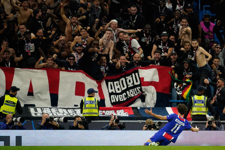 PSG's Maghnes Akliouche celebrates after scoring his side's fourth goal during the Champions League opening phase soccer match between Manchester City and Paris Saint-Germain in Manchester, England, Wednesday, Oct. 14, 2026. (AP Photo/Dave Thompson)