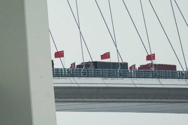 Trucks line up as long-delayed China-North Korea bridge officially opens