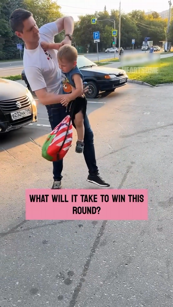 Defiant young child engages in humorous standoff