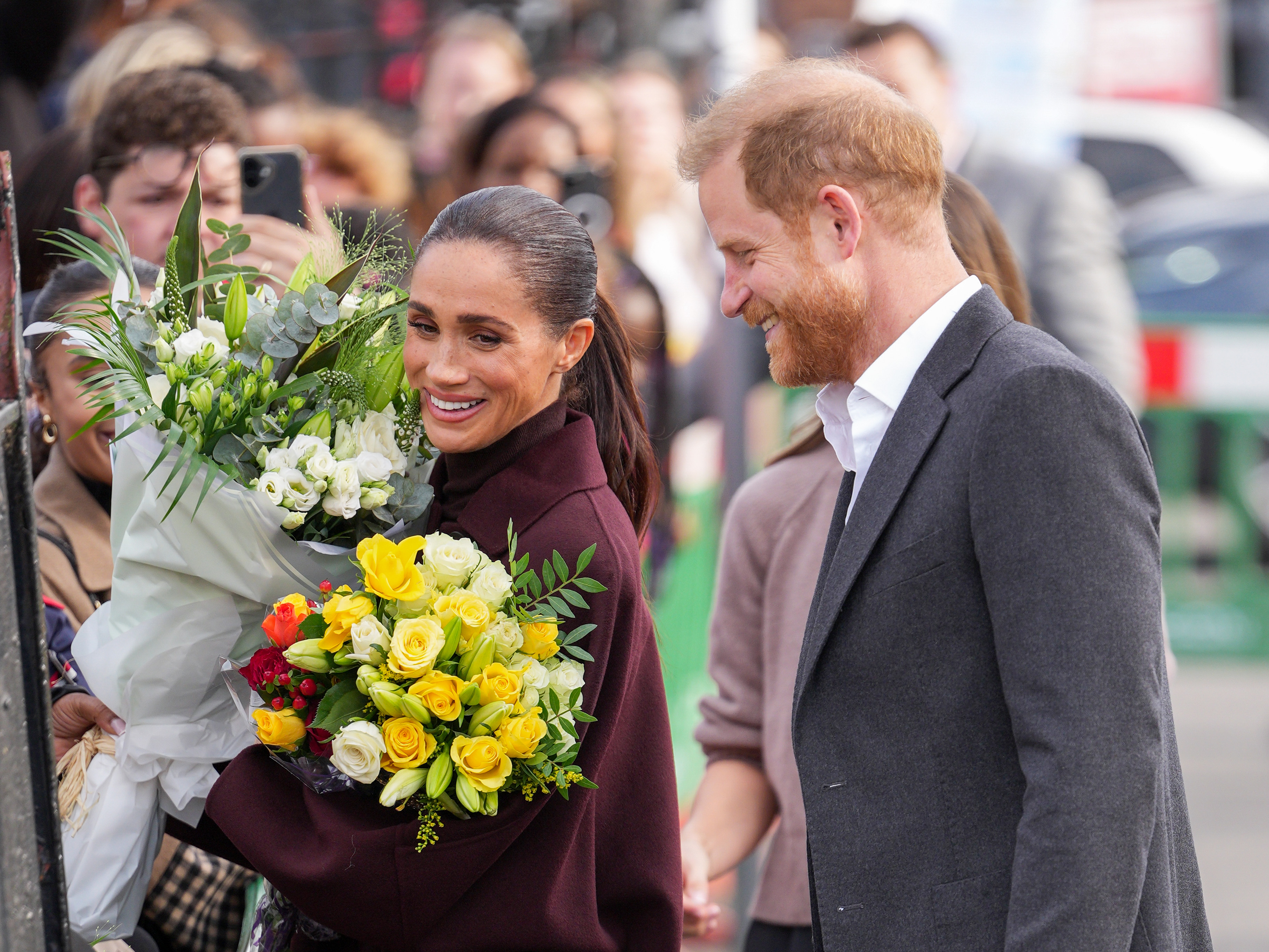 Prince Harry and Meghan Markle are all smiles as they make first ...