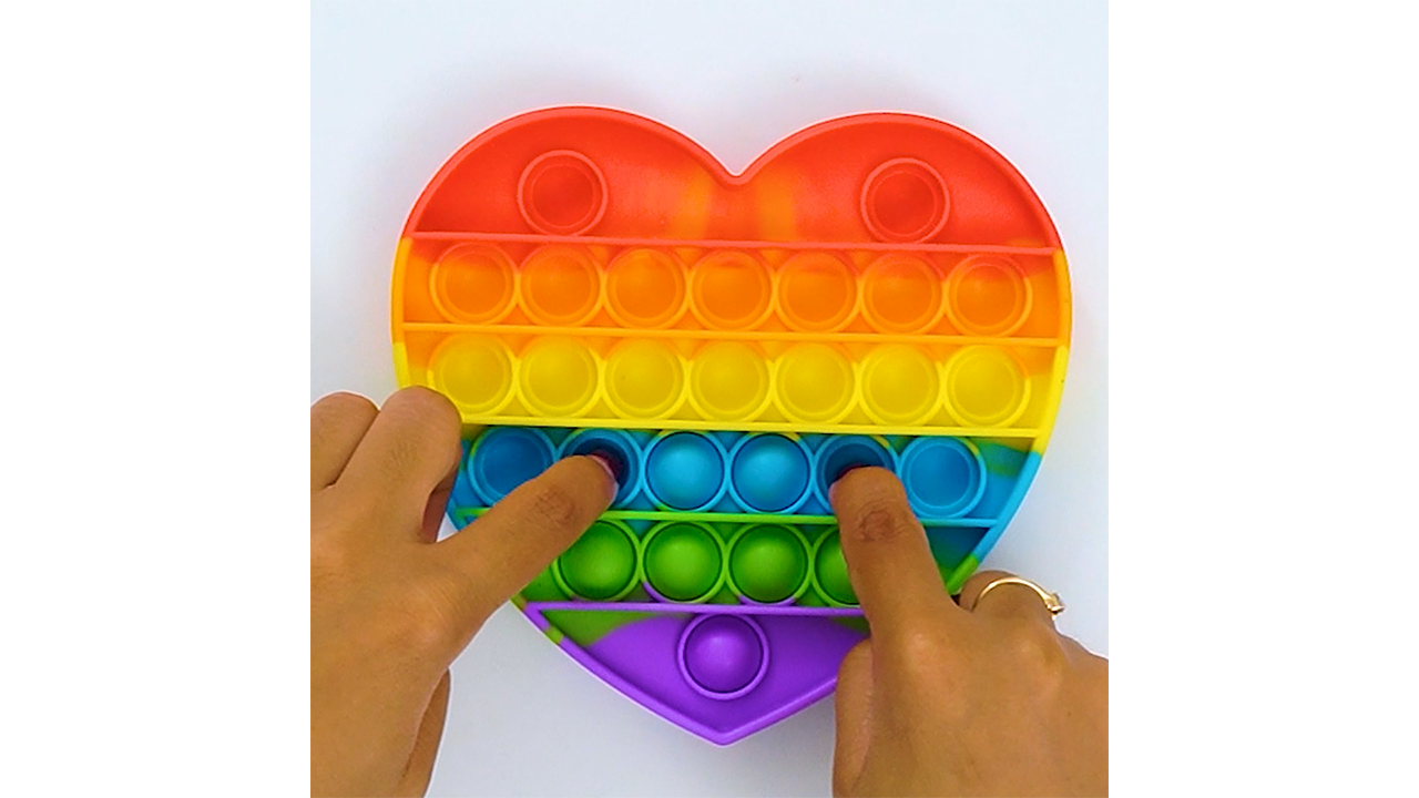 Rainbow heart pops create a bold satisfying bubble rhythm