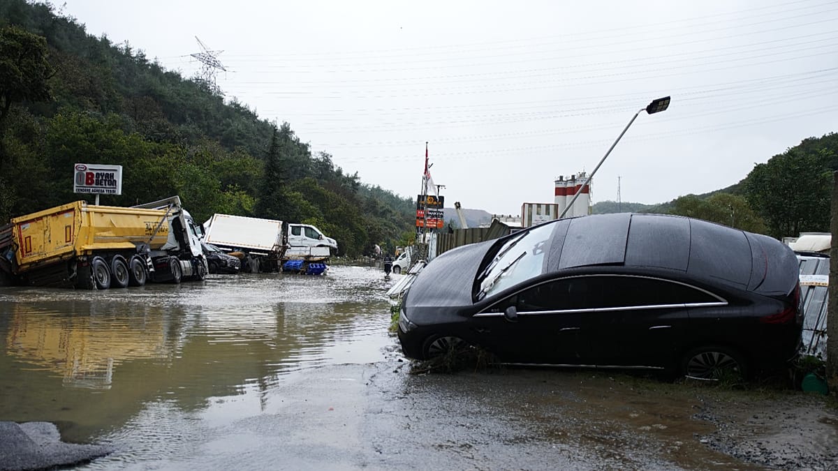 At least two killed after heavy rain and widespread flooding causes ...