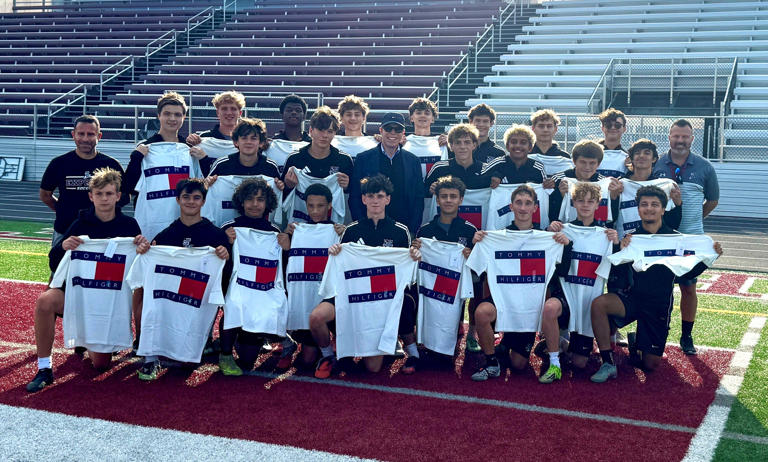 Fashion icon Tommy Hilfiger pays visit to Elmira High boys soccer team