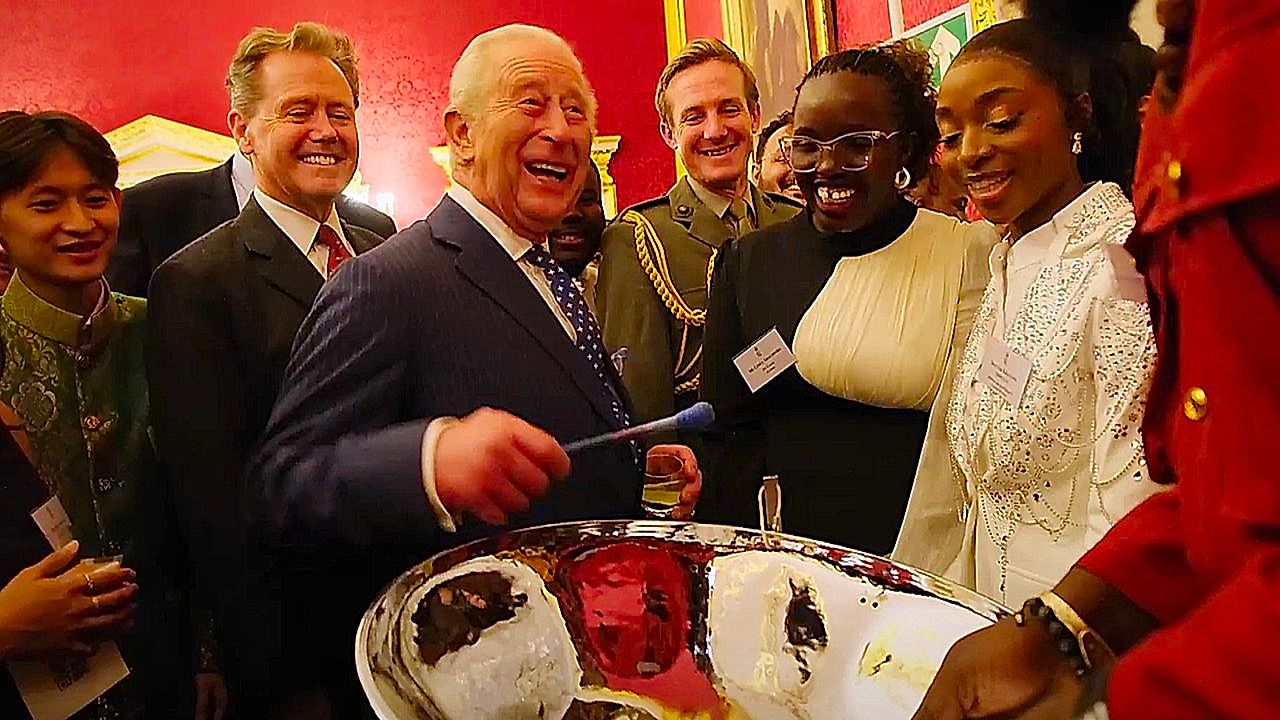 King Charles plays steel drums during Commonwealth reception