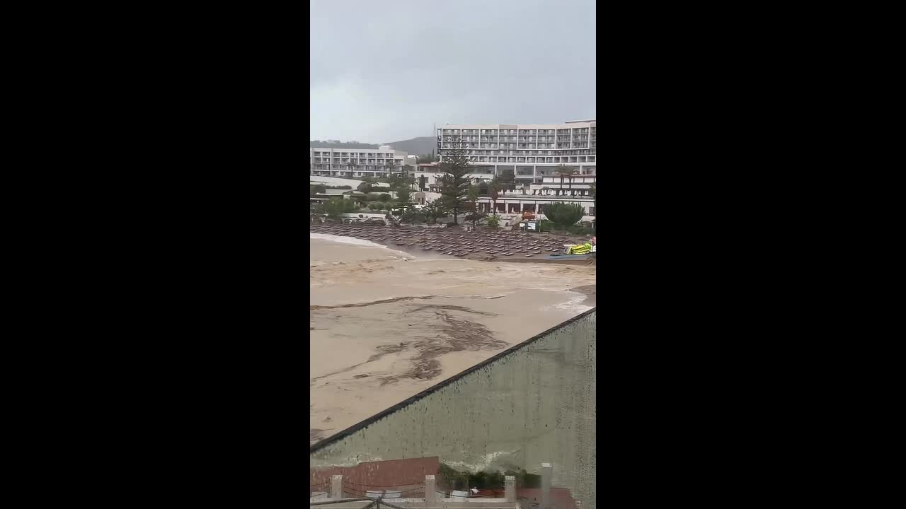 Flash floods sweep away beach furniture at a resort in Rhodes, Greece