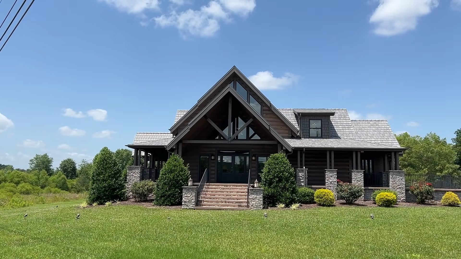 Rustic log cabin charm defines this impressive prefab home