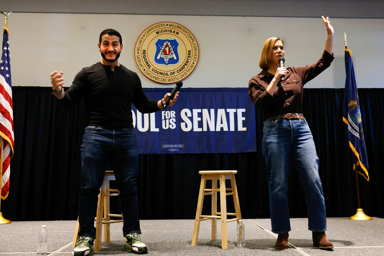 Senate candidate Abdul El-Sayed and Senator Elissa Slotkin share the stage at a town hall campaign event in Warren, Michigan.