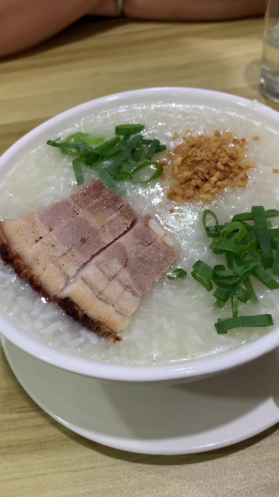 Crispy pork meets warm congee in this comfort food favorite