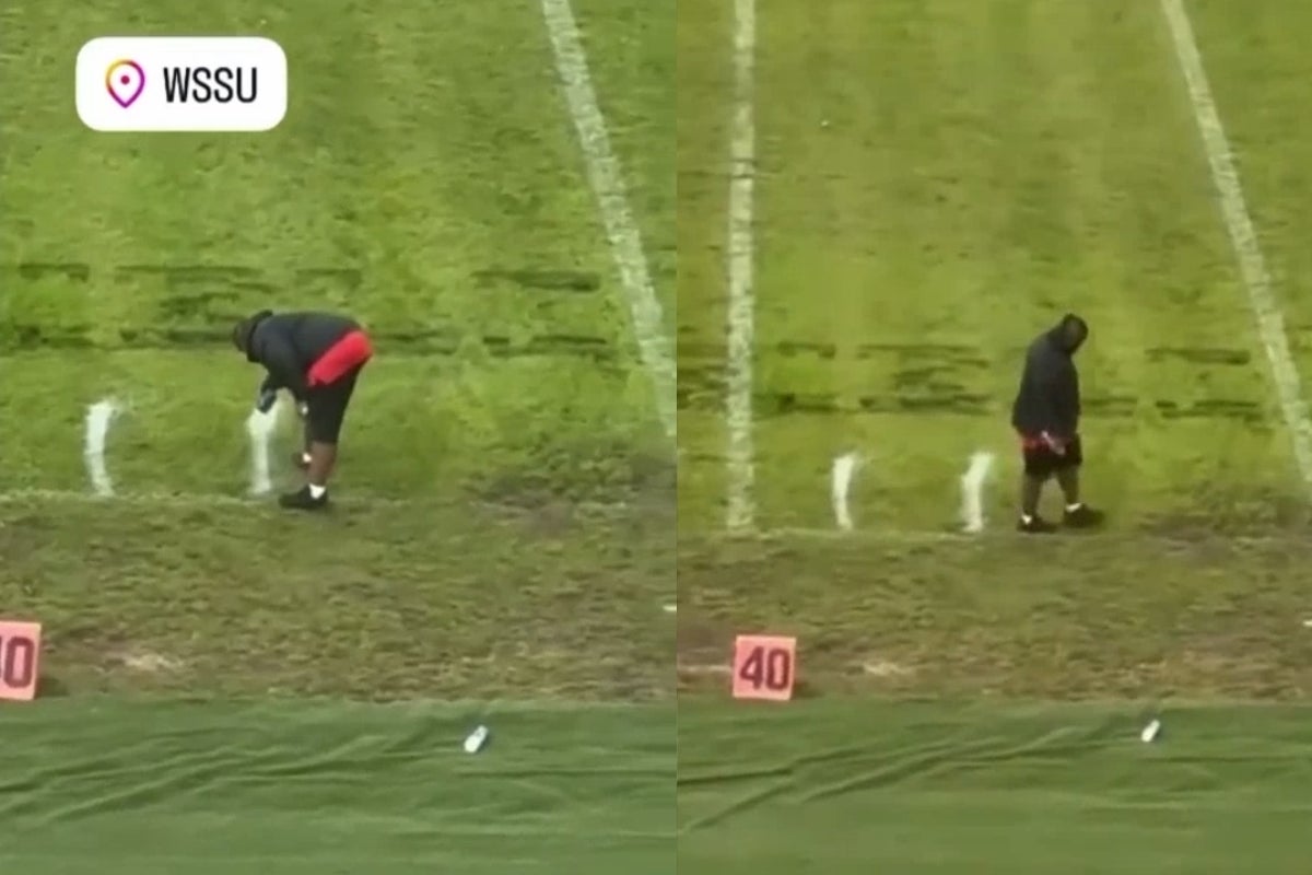 Line painter spotted measuring yardage lines with feet