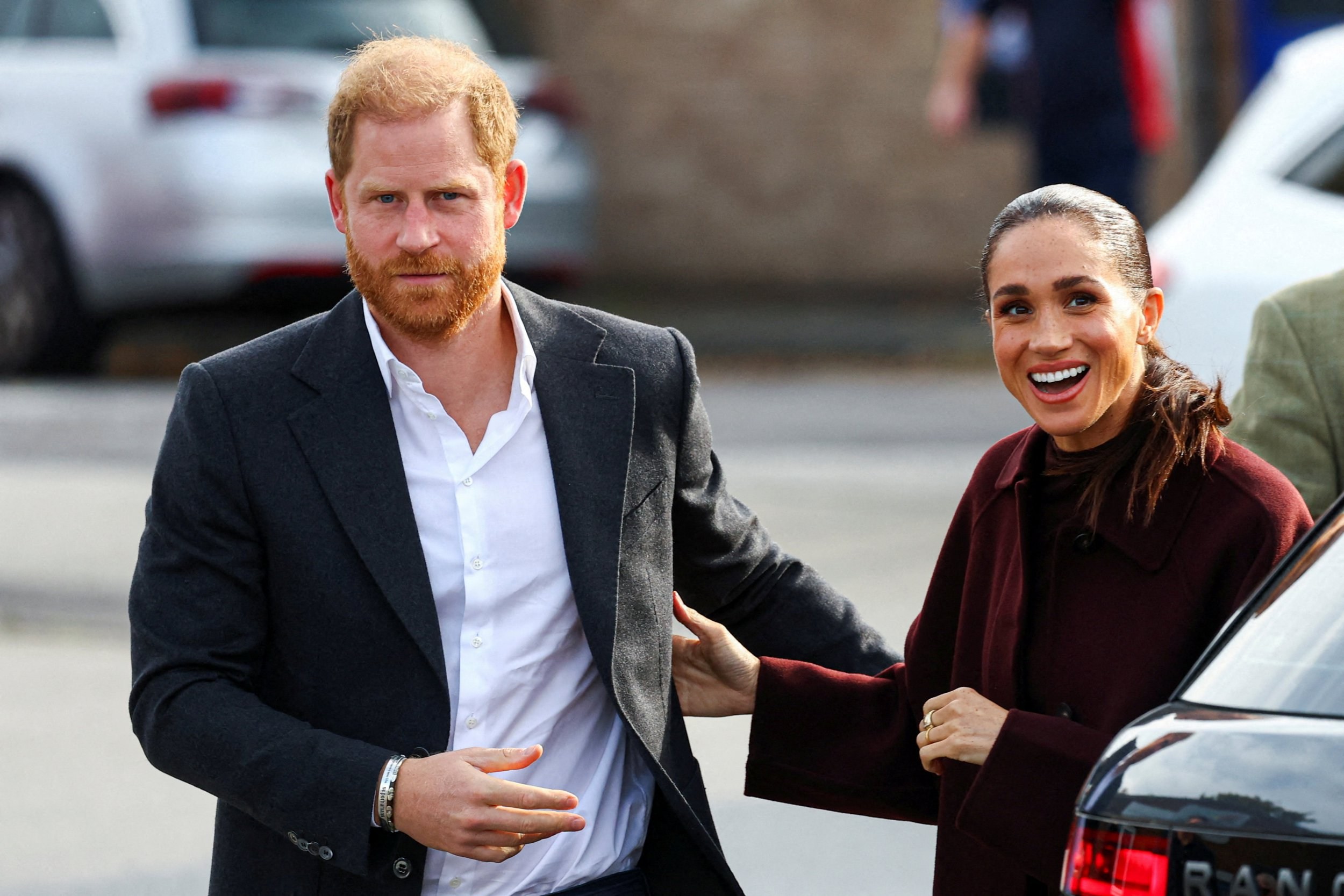 Harry and Meghan heckled during public appearance