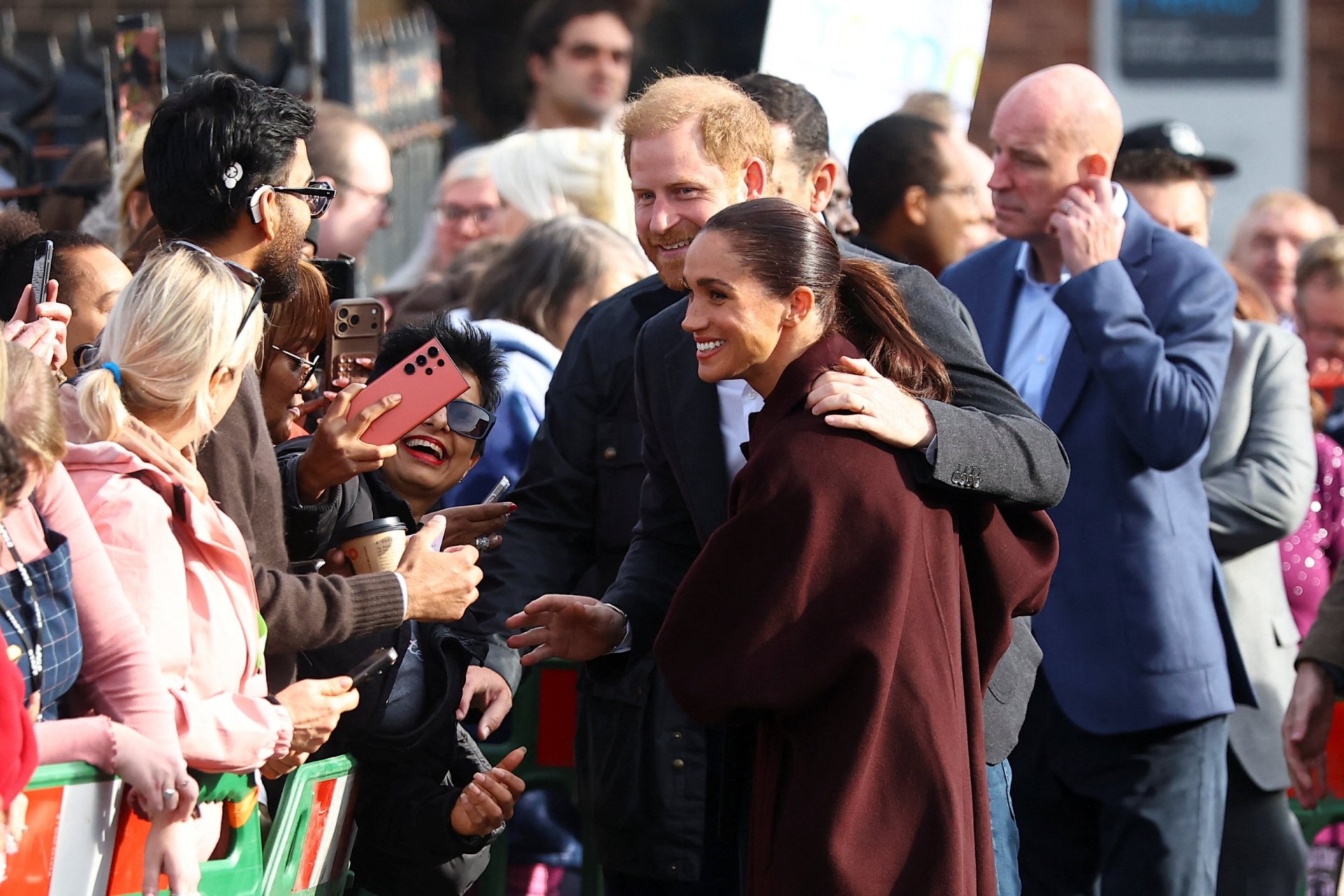Woman heckles Harry and Meghan during their first public outing since ...