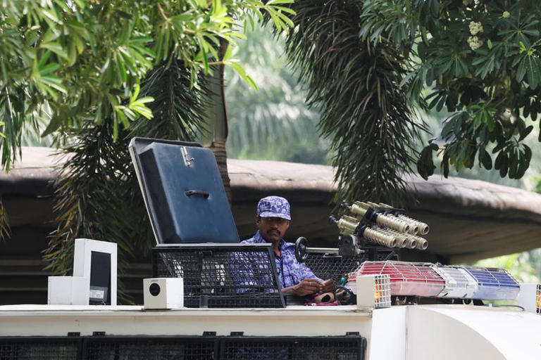 A security officer stands guard in a security vehicle ahead of the flag rally announced by the Cockroach Janta Party (CJP) seeking the resignation of India's Chief Election Commissioner Gyanesh Kumar, near the protest site in New Delhi, India, October 16, 2026. REUTERS/Bhawika Chhabra