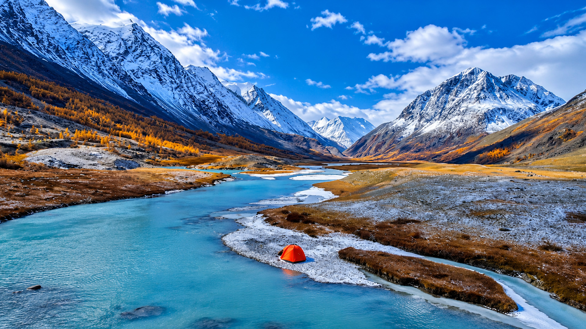 A winding river flows beneath Altai's snowy mountains