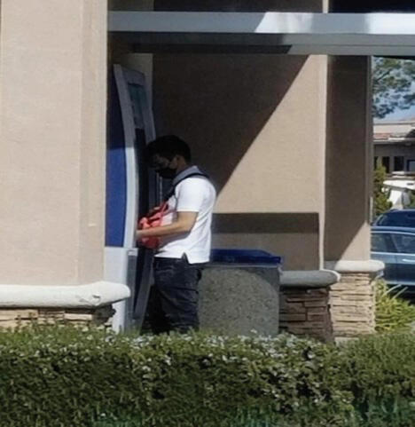 A defendant in the cartel money laundering case deposits alleged drug trafficking cash at an ATM, according to the DEA. / Credit: U.S. Department of Justice