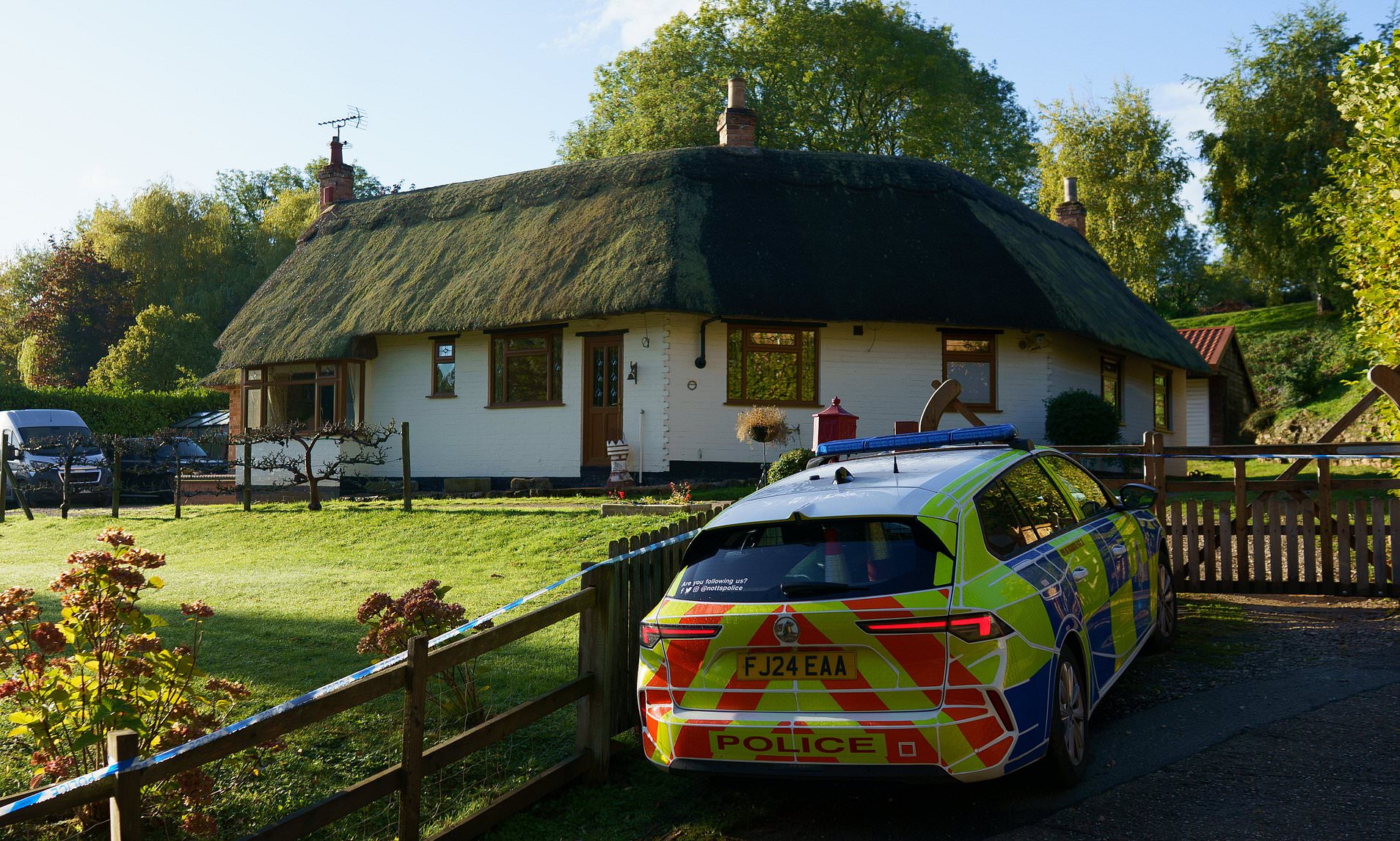 Man's body is found in garden of £800,000 detached house with thatched roof in 'friendly' village