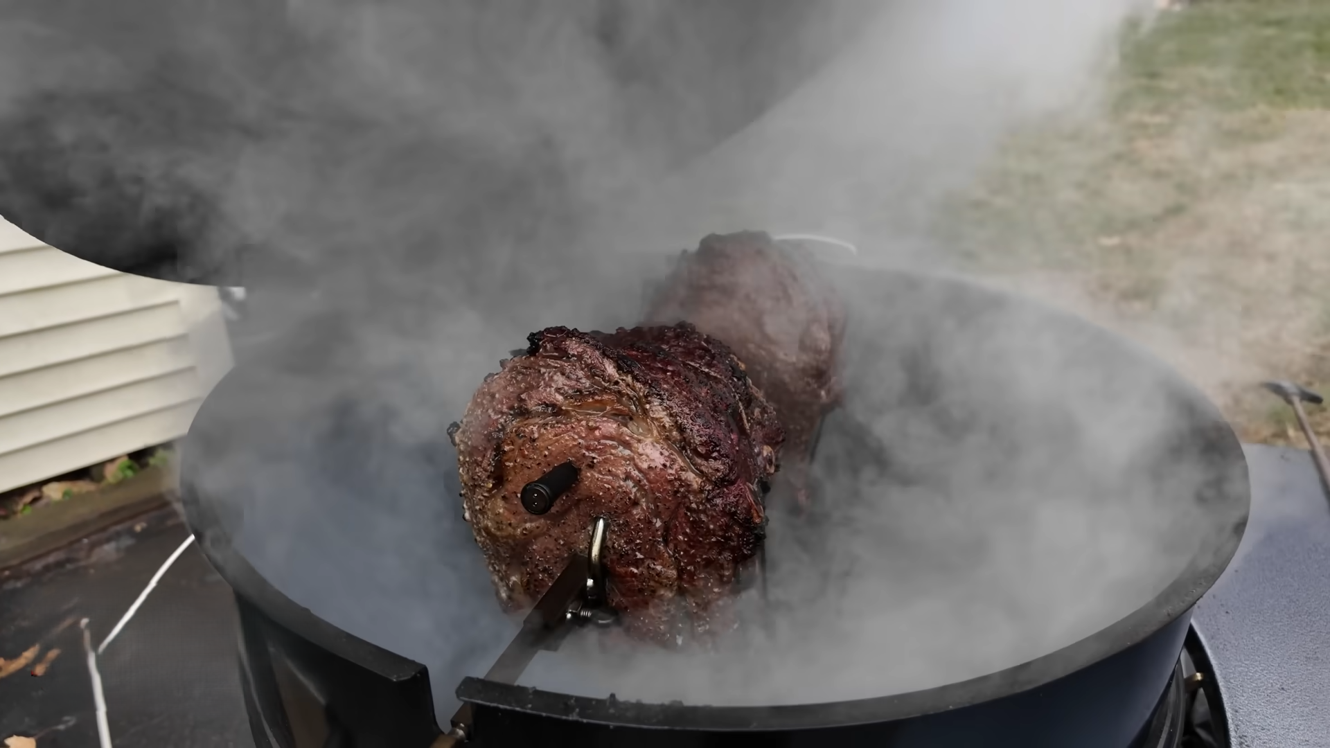 Two 6-pound prime rib roasts cook on a rotisserie after a three-day dry ...
