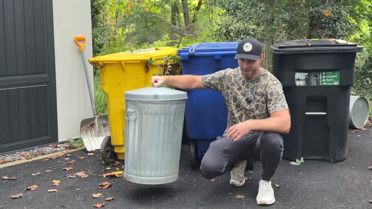A DIY builder builds an 8-foot privacy screen for outdoor bins