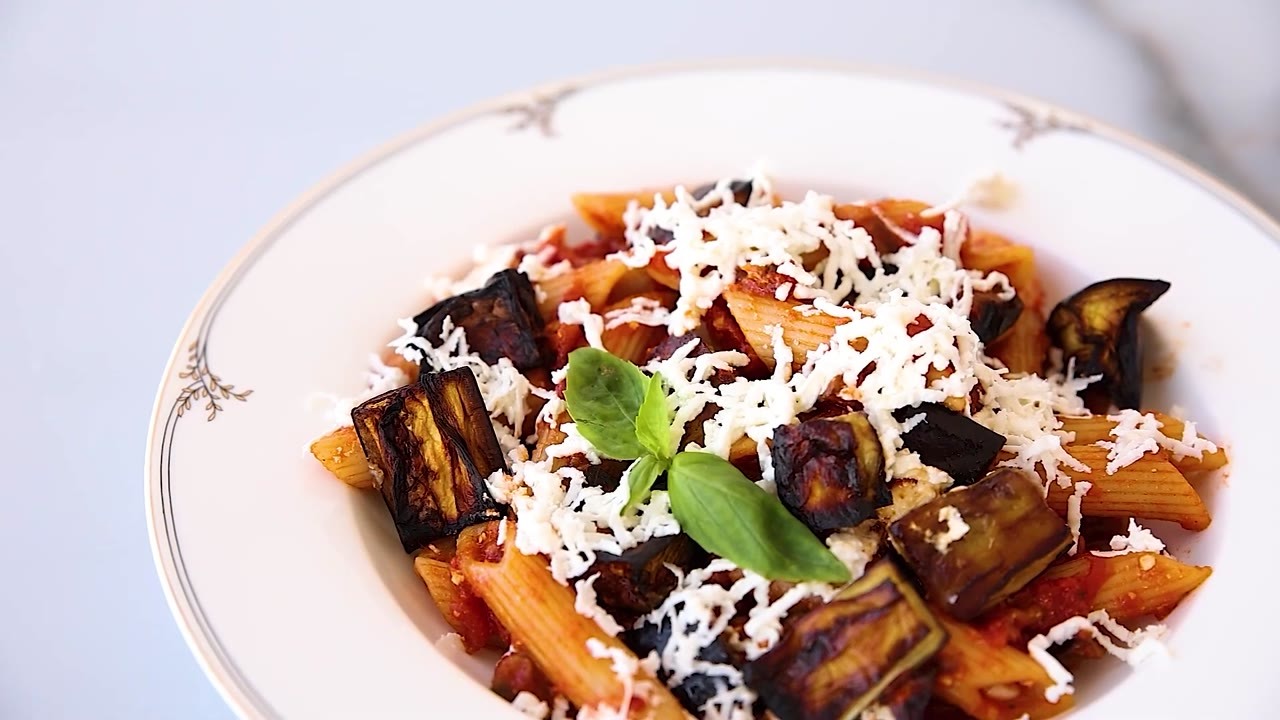 Pasta alla Norma got its finishing touch from crumbled ricotta salata
