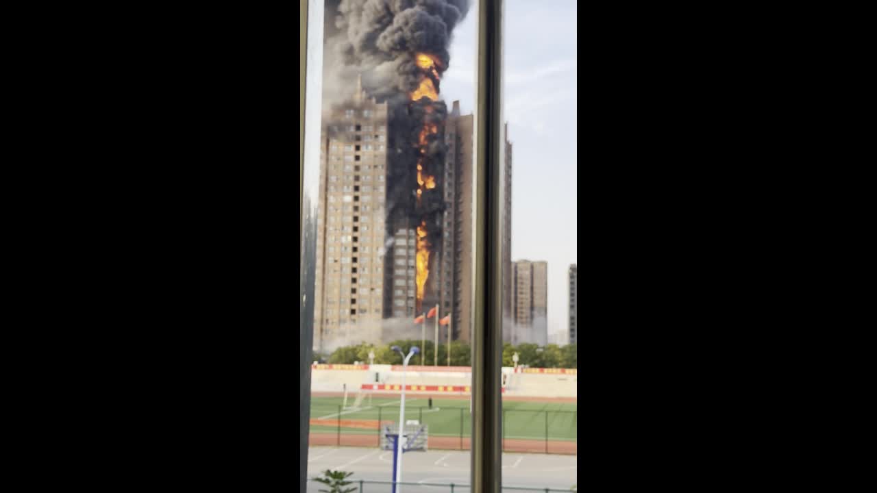 Massive high-rise apartment fire sends thick black smoke into the sky ...