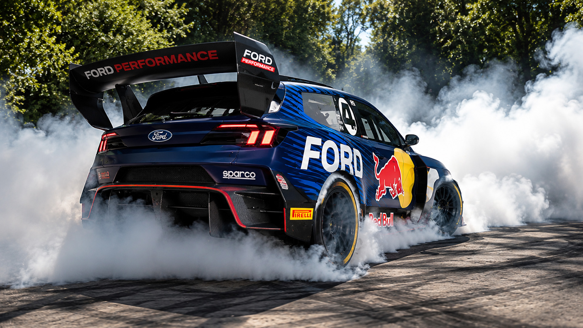 Ford SuperVan 4.2 performs tire smoking burnout at Goodwood
