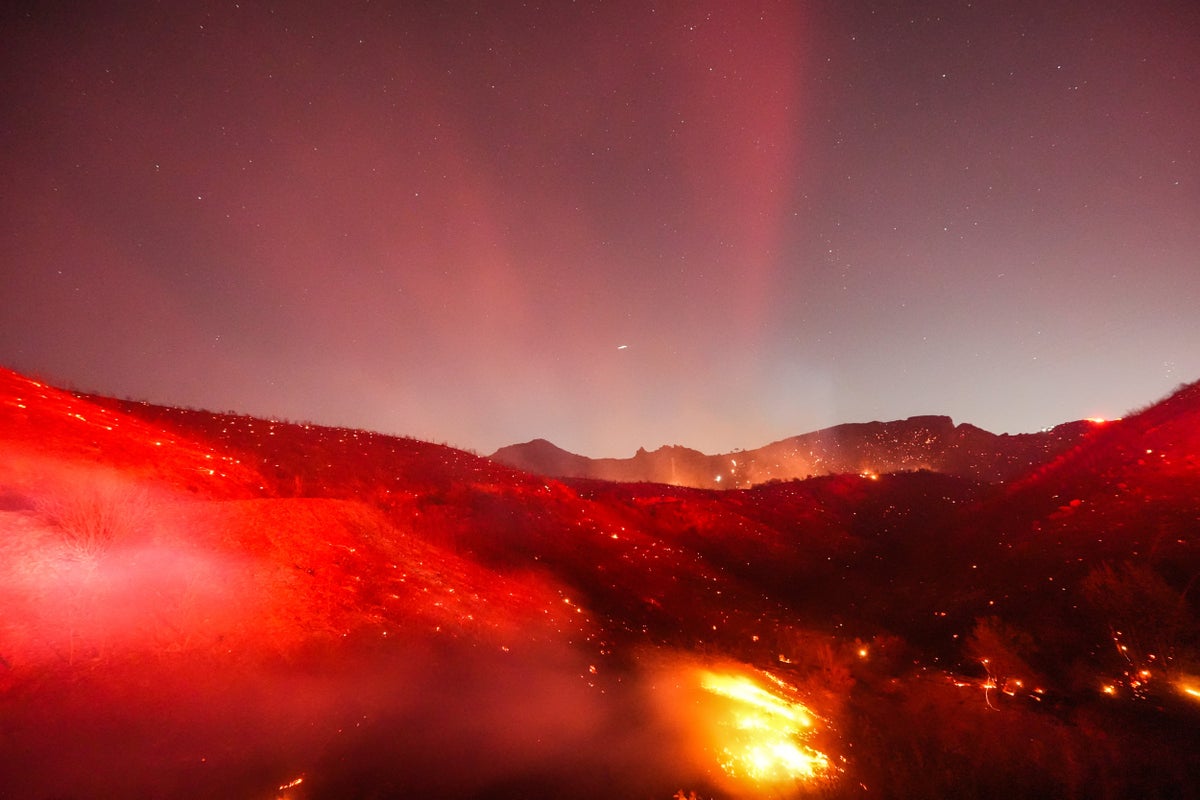 California homes engulfed in flames as multiple fast-moving fires rage