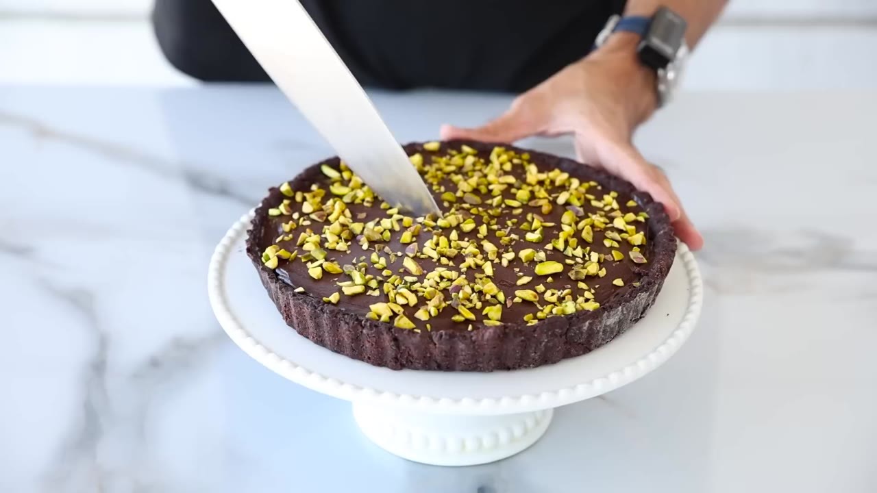 A smooth chocolate topping covered the crunch in his Dubai chocolate tart