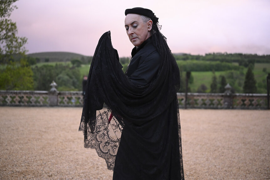 All of Alan Cumming's Daring & Dazzling Outfits on The Traitors: New Blood