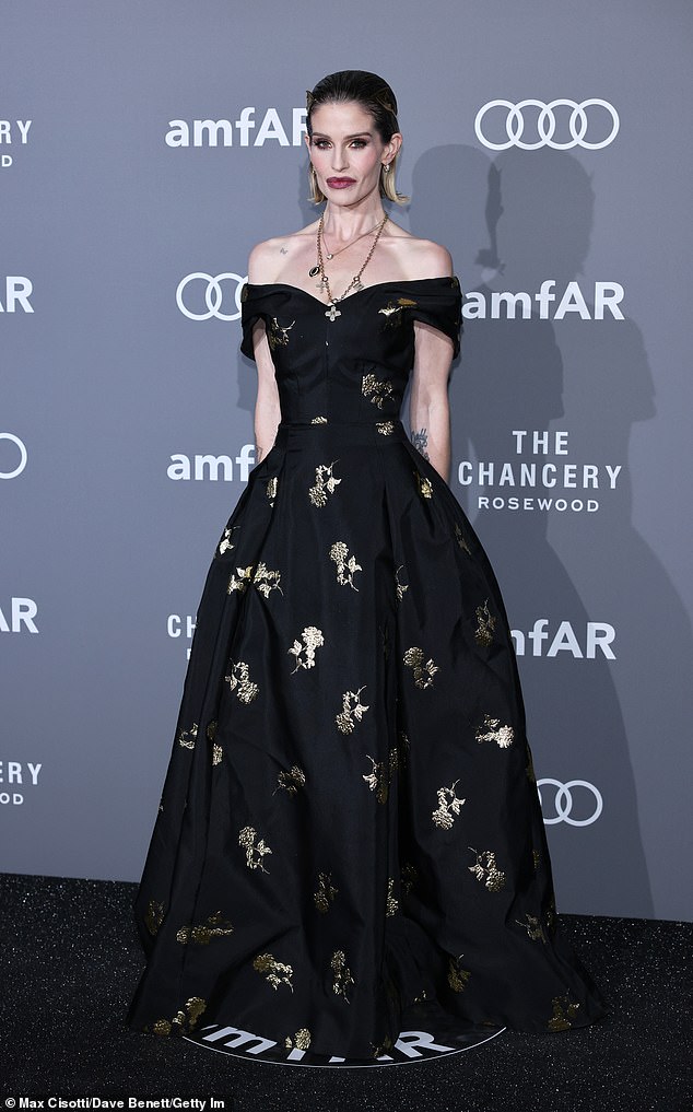 Rita Ora turns heads in a quirky headpiece as she and Kelly Osbourne ...