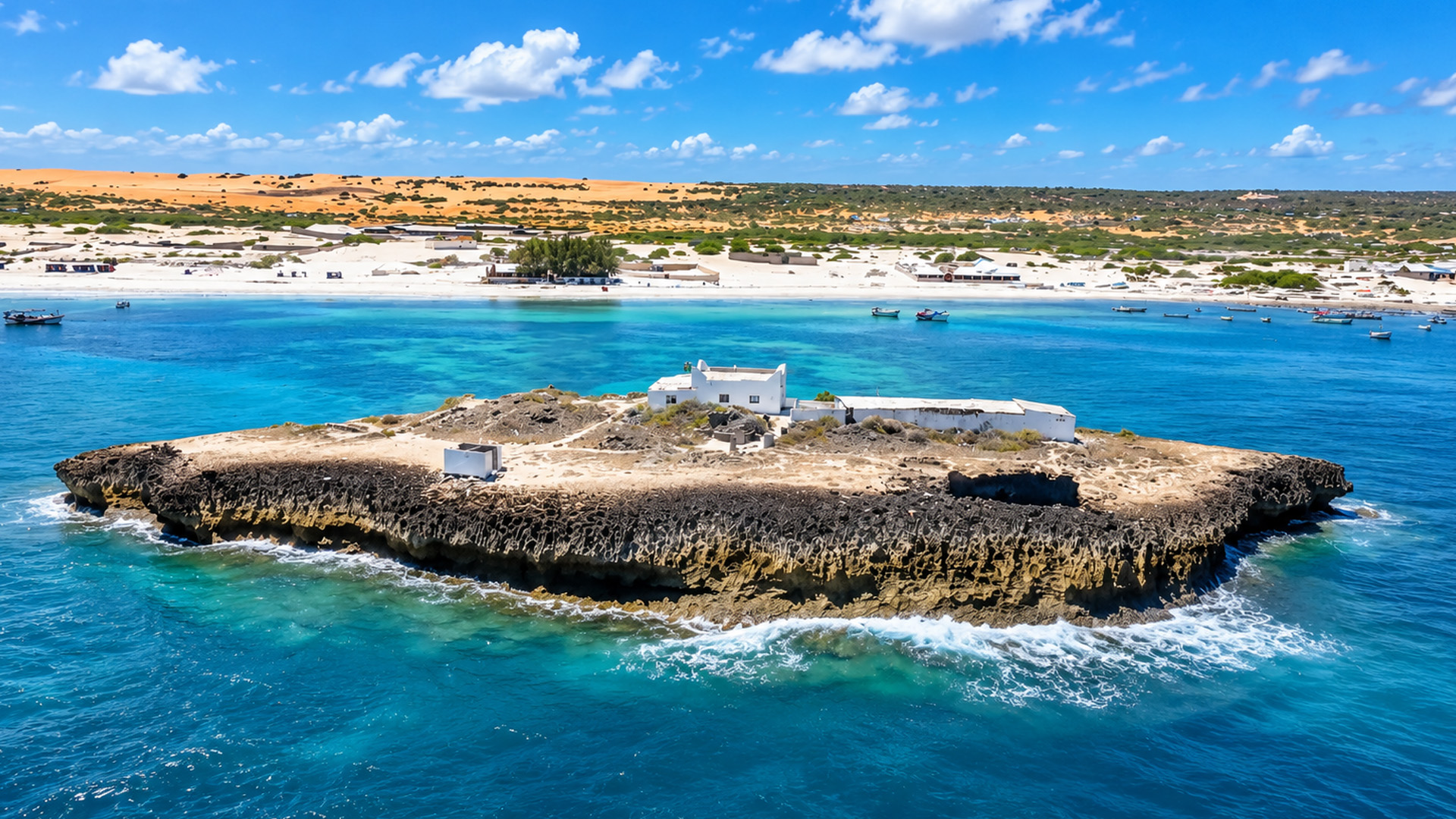 A small rocky island surrounded by turquoise water