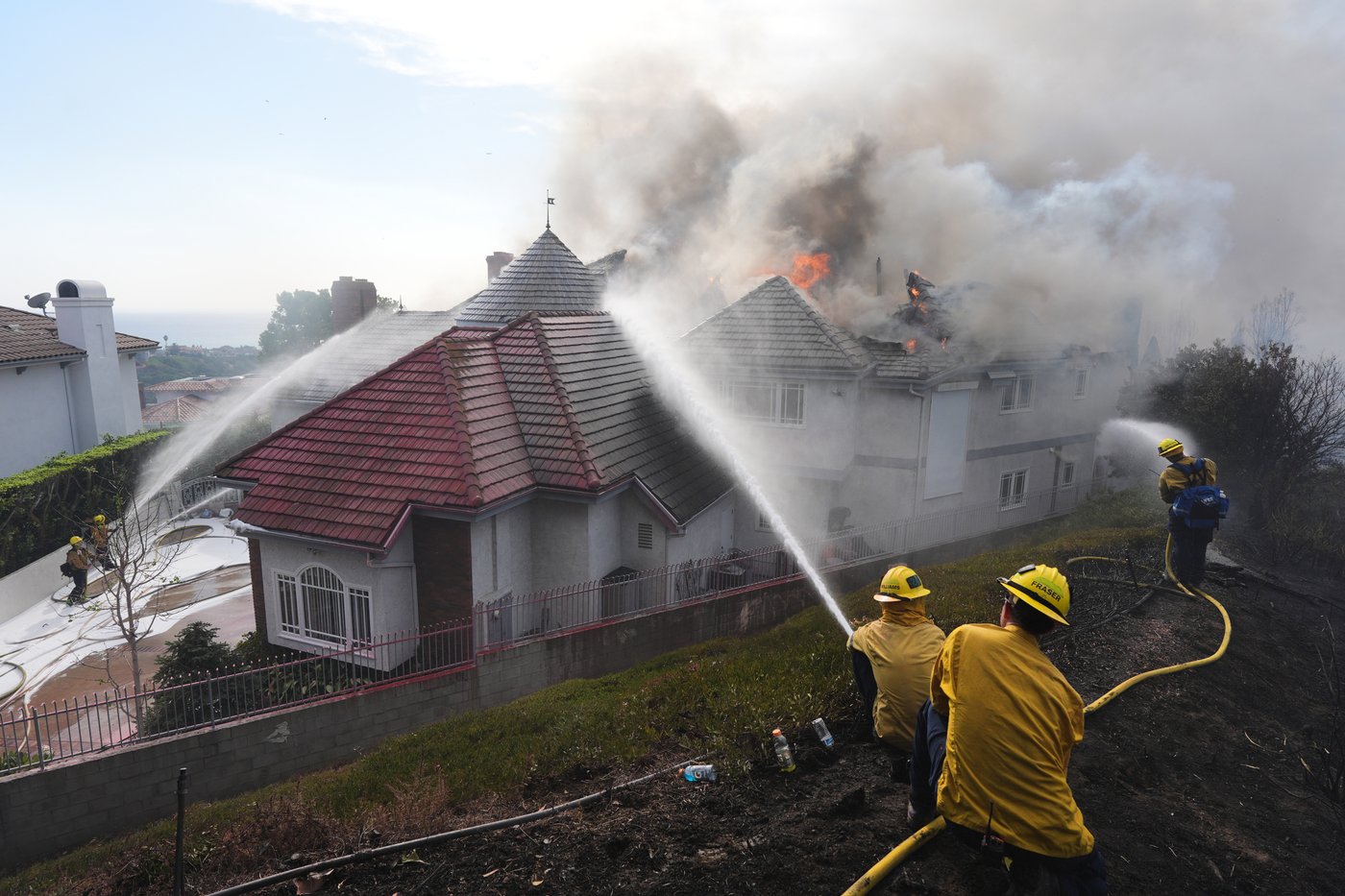 Multiple Southern California homes are ablaze in a fast-moving wildfire ...