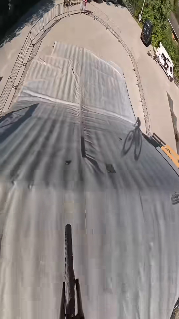 Catching huge airtime on a steep mountain bike jump