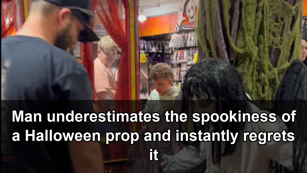 Funny man gets startled when a Halloween statue responds to his inspection