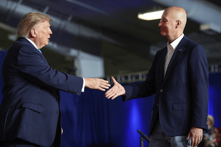 President Donald Trump greets Nebraska Senator Pete Ricketts during a campaign rally at Pinnacle Bank Expo Center on the Nebraska State Fairgrounds on October 5, 2026, in Grand Island.