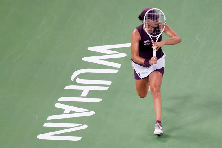 Tennis-injured Swiatek goes down fighting in Wuhan Open semi-final