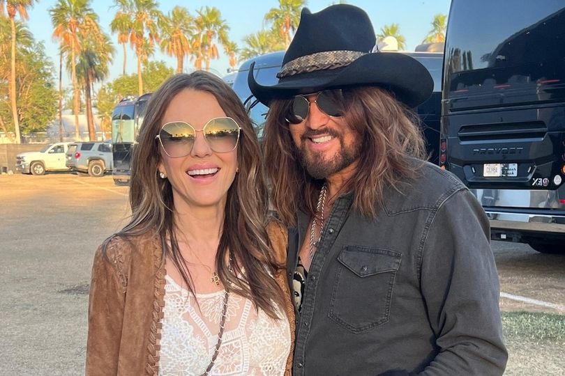Liz Hurley sparks engagement rumours as she strips down to white robe ...