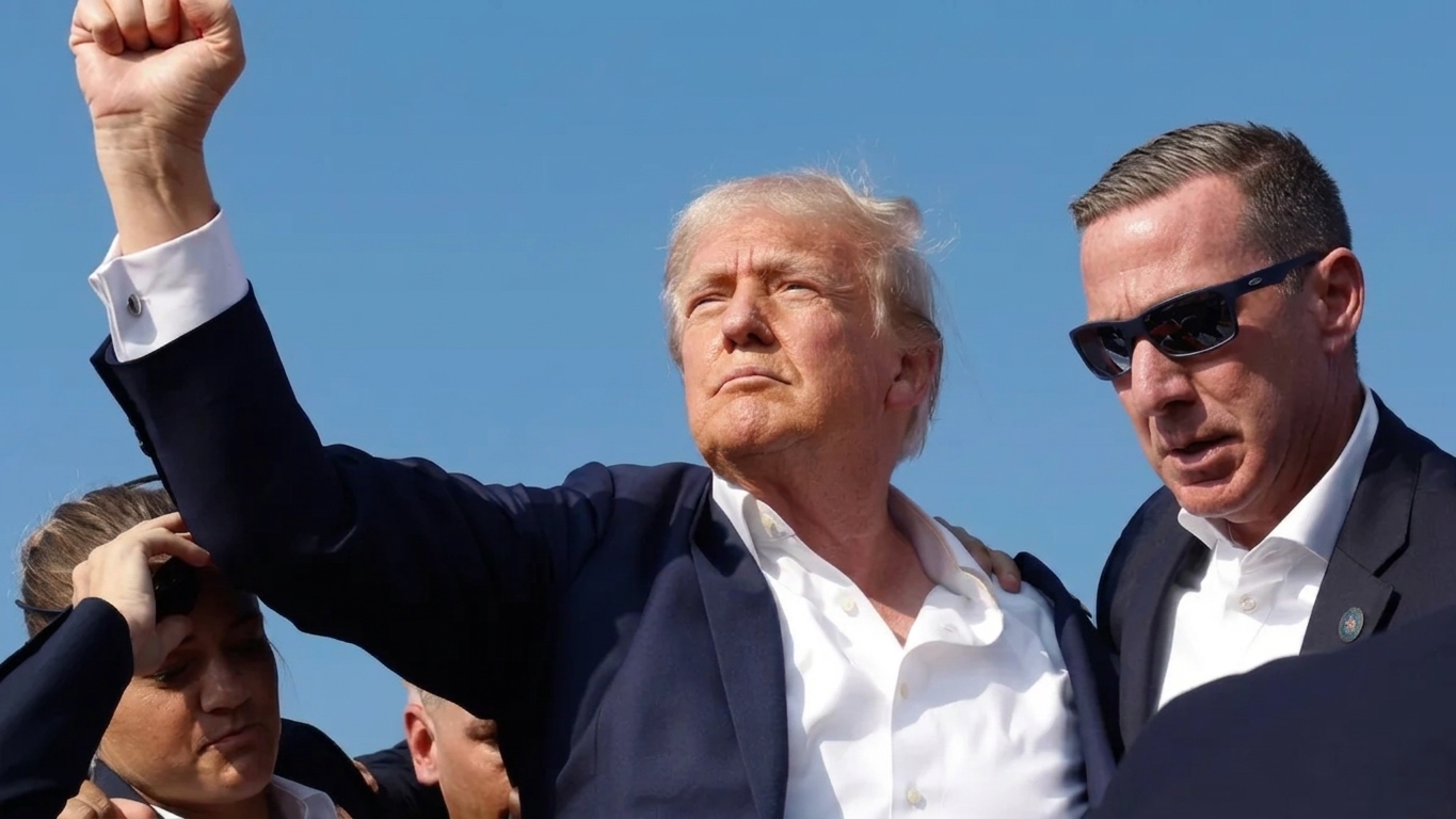 Trump grabbed his ear and dropped - seconds later agents said 