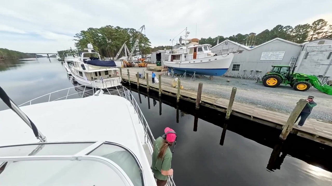 A boat crew passes through the Great Bridge Lock on the Virginia Cut ...