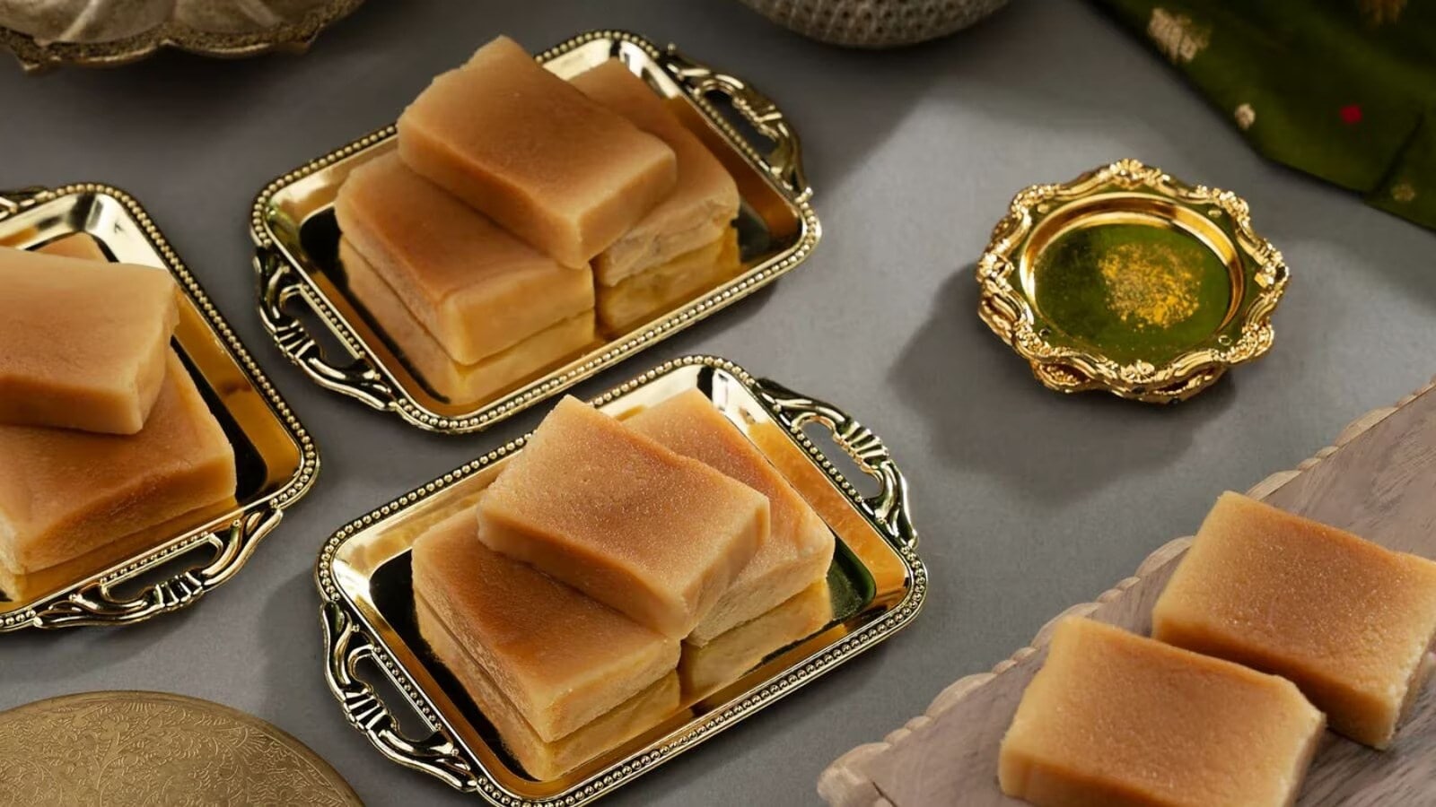 Mysore Pak is a traditional Indian sweet that originated in Mysore, Karnataka. It is primarily prepared using three ingredients: gram flour (besan), sugar and ghee. The right proportions of these ingredients, combined with careful preparation, give the sweet its distinctive taste and texture. A well-made Mysore Pak typically has a rich, buttery flavour and a texture that can range from slightly firm and porous to exceptionally soft and crumbly. Over the years, the sweet has travelled far beyond Karnataka and gained popularity across the country.