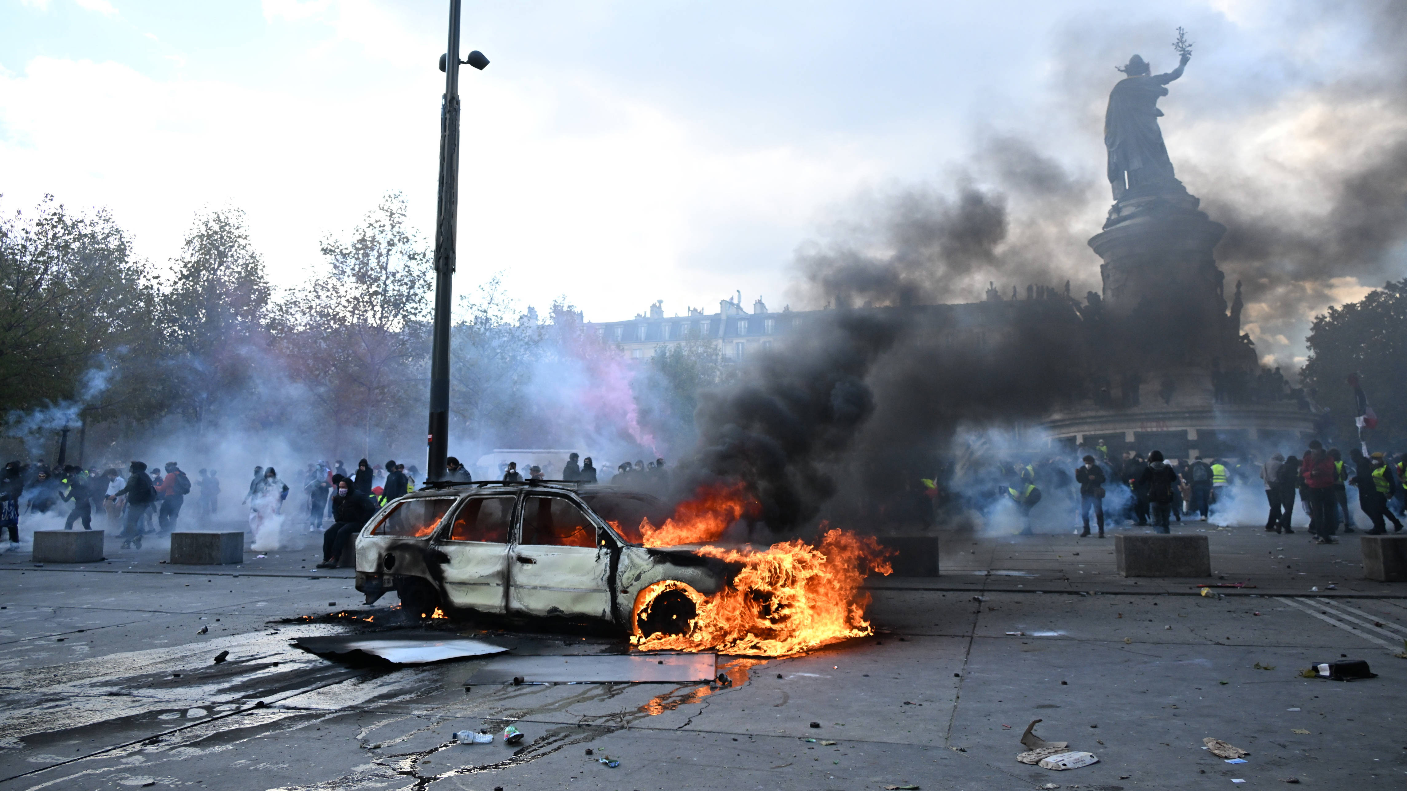 Clashes and fires break out as protesters rally across France
