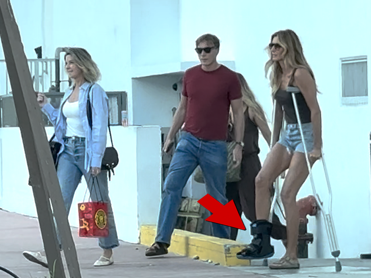 Gisele Bündchen walks on crutches and wears medical boot after foot injury