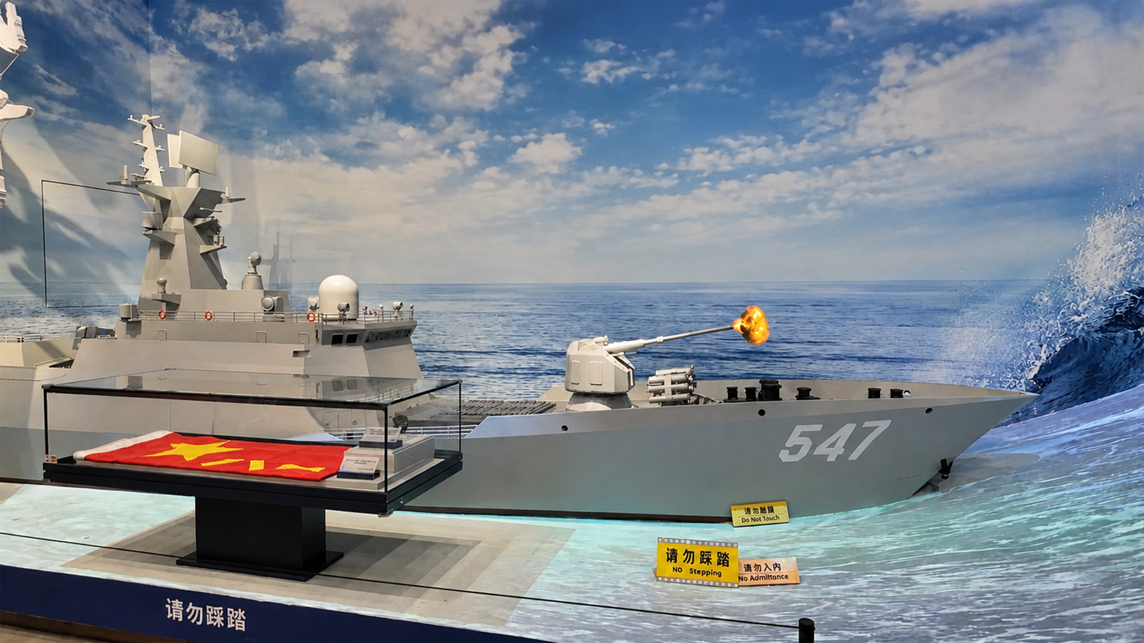 China’s naval exhibit places warship against rough seas