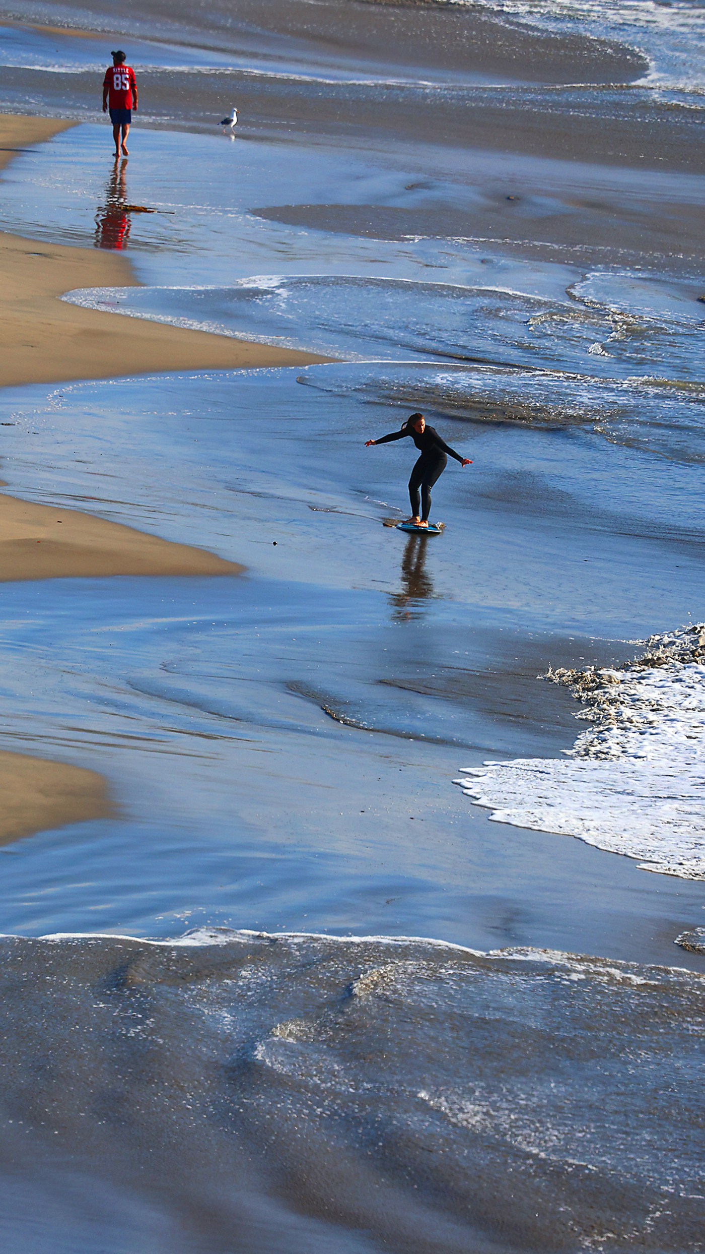 Photo | Run, drop and slide at Cowell Beach surf zone