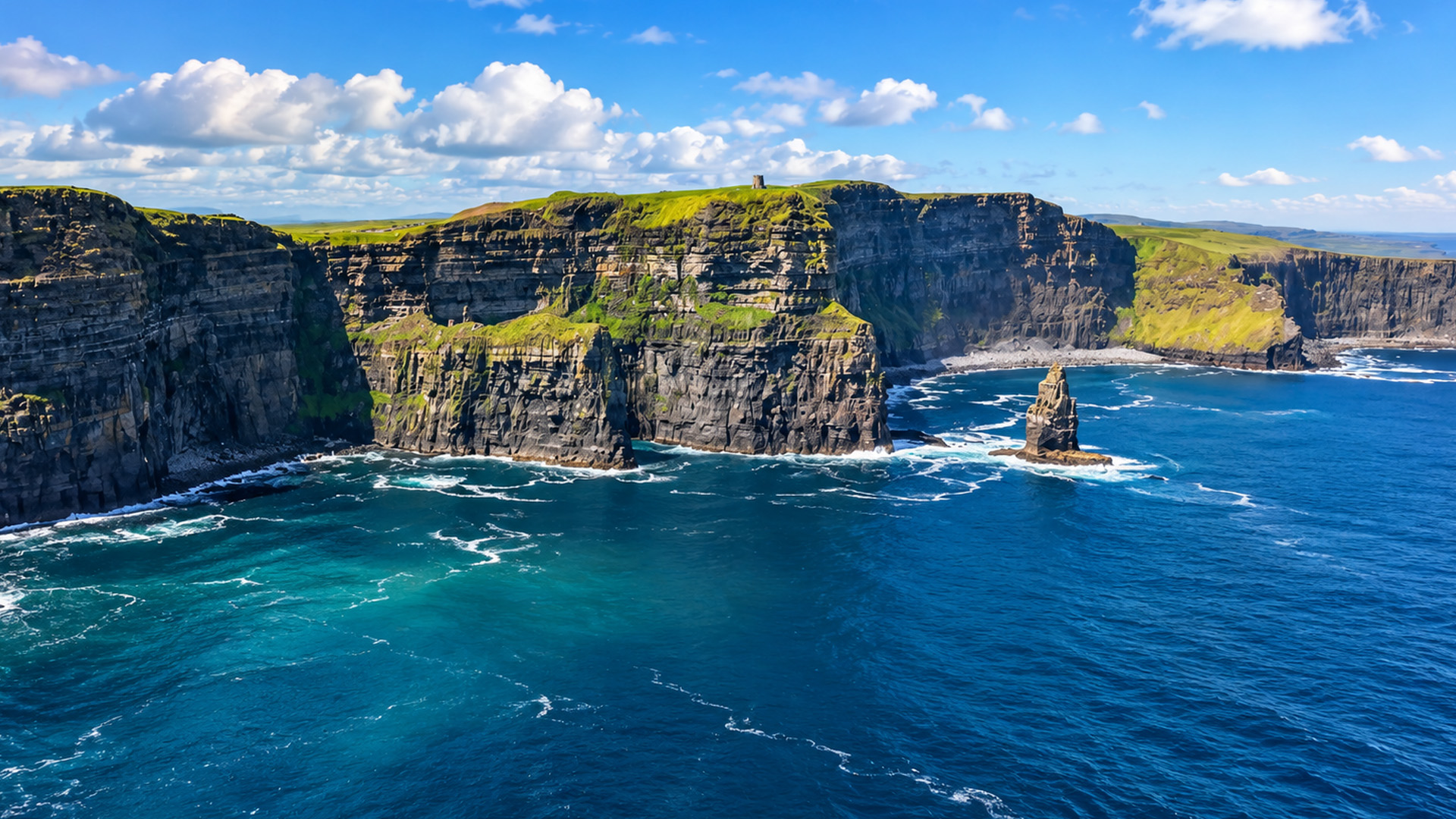 What is that tower above Scotland's sea cliffs?