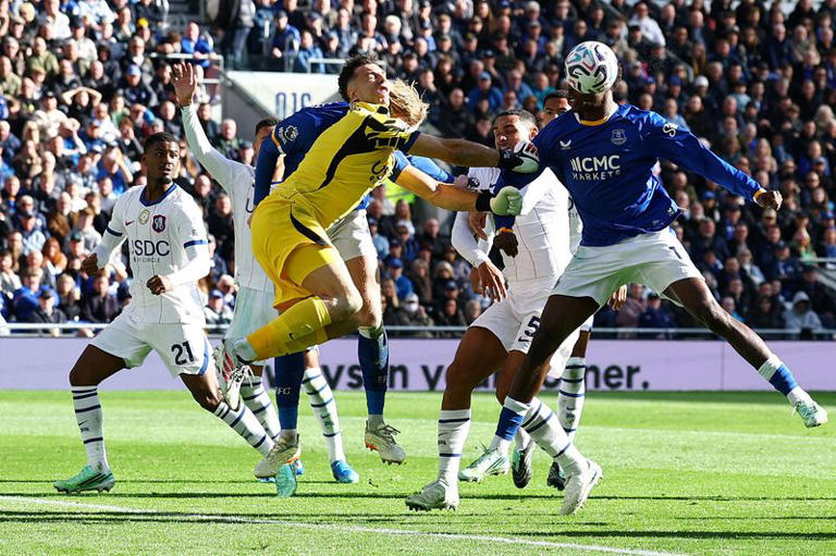 Soccer-Neto double fires Chelsea past Everton but Martinez injury mars win