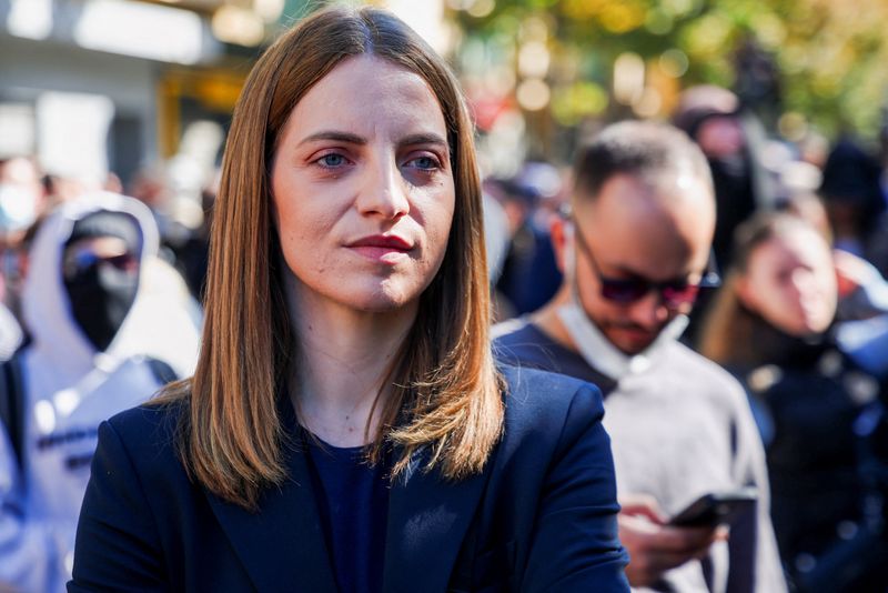 Marjana Koceku, a member of the Parliament of Albania, stands with demonstrators during an anti-government protest by students in Tirana, Albania, October 17, 2026. REUTERS/Florion Goga